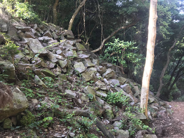 The countless stone megaliths piled up along the mountain road