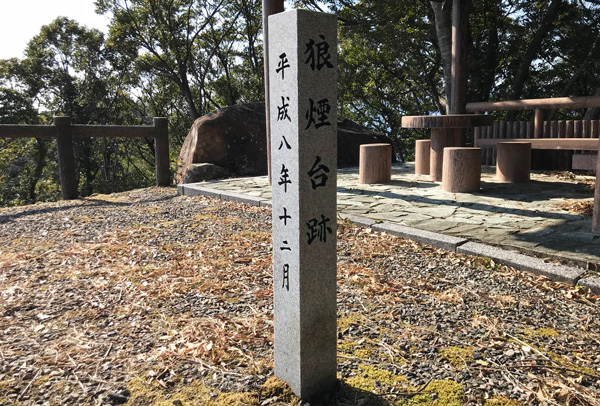 A stone monument at the site of the Smoke Signa platform which is located  at the top of Takegashima Island.